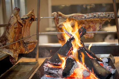 Antikristo Unique Cretan Meat Cooking on fire